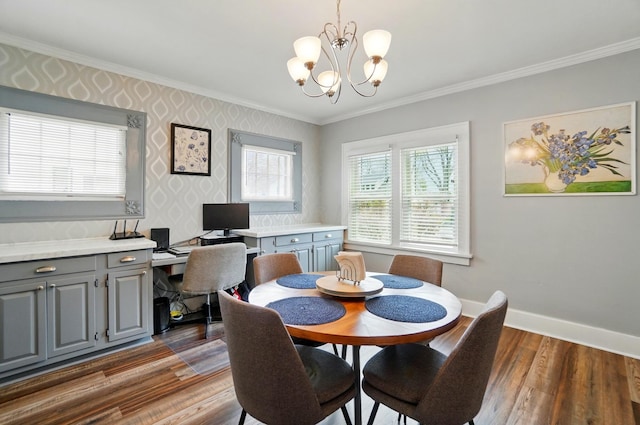 114 Roosevelt Dr, Springfield, OH 45504 - dining space with ornamental molding, a chandelier, wallpapered walls, dark wood-style floors, and baseboards