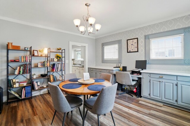114 Roosevelt Dr, Springfield, OH 45504 - dining room featuring crown molding, a chandelier, wood finished floors, an office area, and wallpapered walls