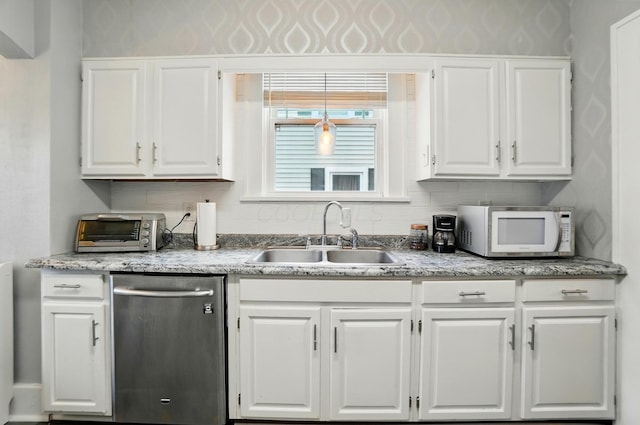 114 Roosevelt Dr, Springfield, OH 45504 - kitchen featuring white microwave, dishwasher, a sink, white cabinetry, and wallpapered walls