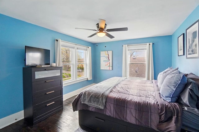 114 Roosevelt Dr, Springfield, OH 45504 - bedroom featuring multiple windows, baseboards, dark wood finished floors, and a ceiling fan