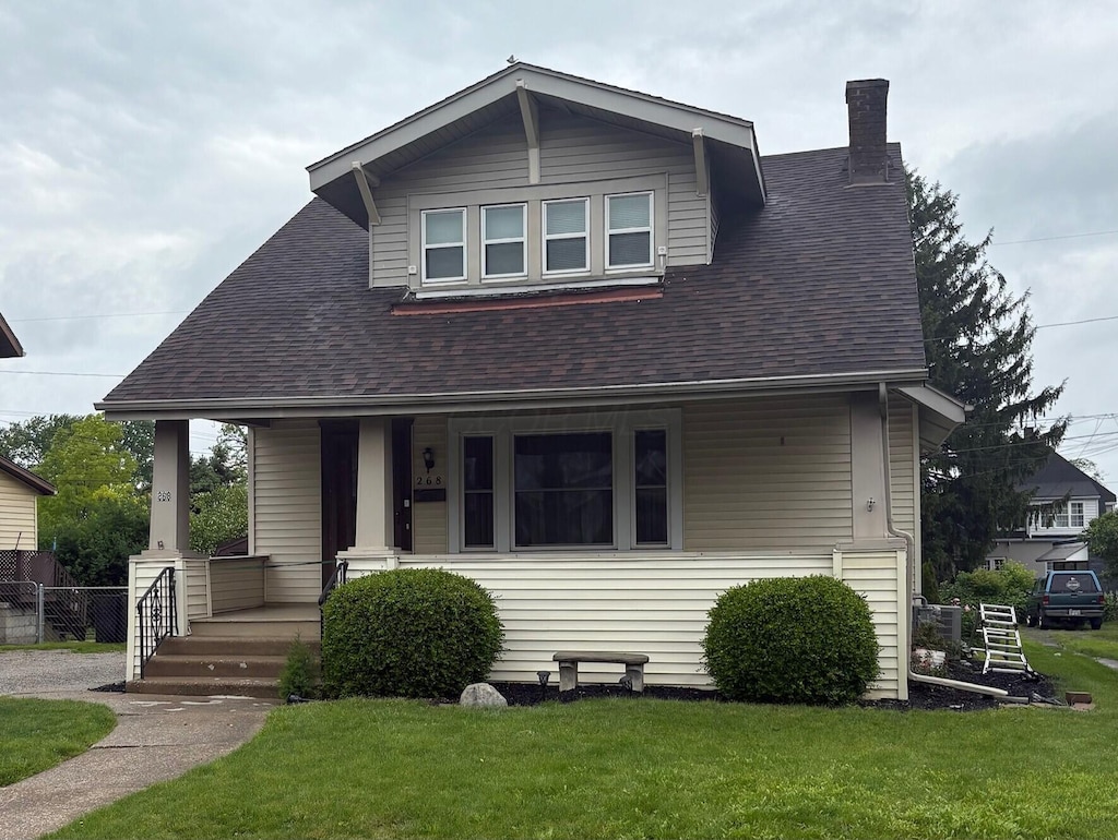 268 Thew Ave, Marion, OH 43302 - bungalow-style house featuring a porch, a chimney, and roof with shingles