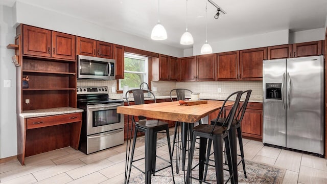 1314 N Howell Dr, Newark, OH 43055 - kitchen with stainless steel appliances, backsplash, decorative light fixtures, wood counters, and open shelves