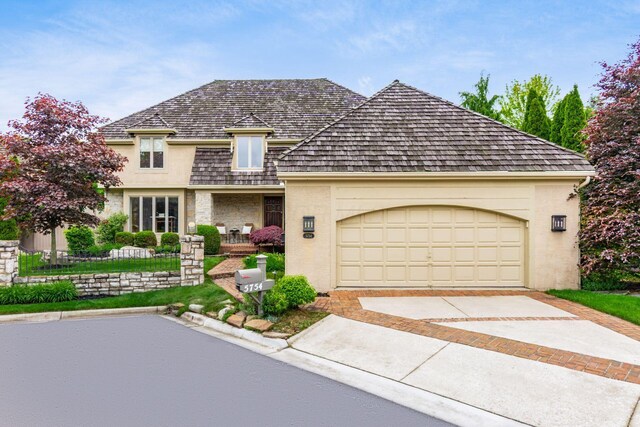 5754 N Loch Maree Ct N, Dublin, OH 43017 - view of front of home with concrete driveway and an attached garage