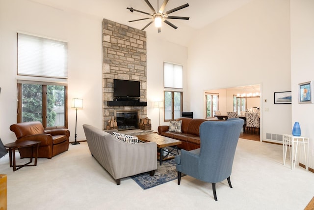 5754 N Loch Maree Ct N, Dublin, OH 43017 - living area with a ceiling fan, high vaulted ceiling, a fireplace, light colored carpet, and baseboards