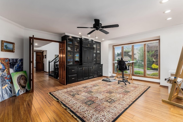 5754 N Loch Maree Ct N, Dublin, OH 43017 - living area with light wood-type flooring, a ceiling fan, crown molding, stairs, and recessed lighting