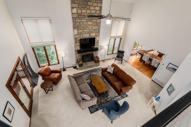 5754 N Loch Maree Ct N, Dublin, OH 43017 - living room with a towering ceiling, a ceiling fan, and a stone fireplace