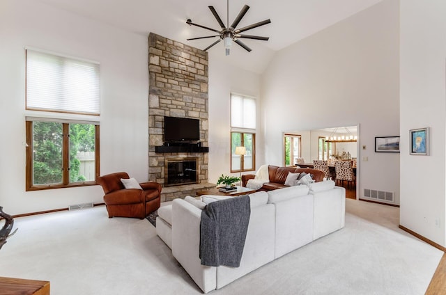 5754 N Loch Maree Ct N, Dublin, OH 43017 - living area featuring high vaulted ceiling, a ceiling fan, plenty of natural light, a stone fireplace, and baseboards