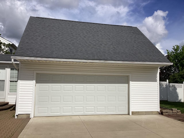 garage featuring fence