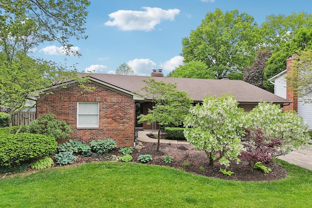 499 Wickham Way, Columbus, OH 43230 - view of front of home featuring a chimney, brick siding, and roof with shingles