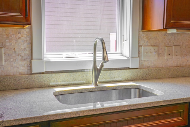 163 E 3rd Ave, Columbus, OH 43201 - kitchen view of a sink, light countertops, and backsplash