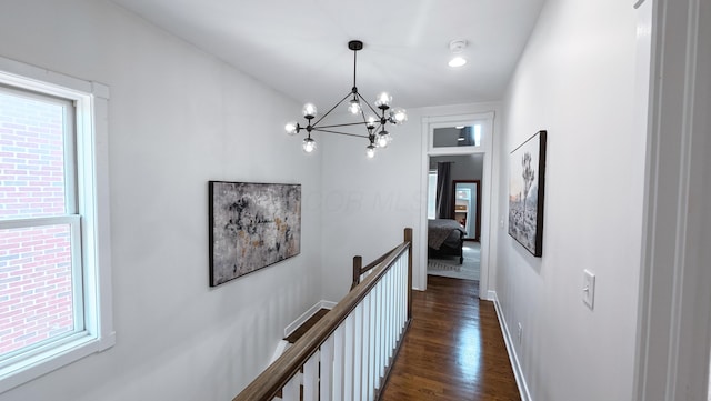 163 E 3rd Ave, Columbus, OH 43201 - hallway with an upstairs landing, healthy amount of natural light, a chandelier, and dark wood-type flooring