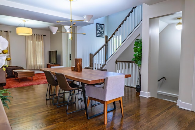 163 E 3rd Ave, Columbus, OH 43201 - dining space with a chandelier, wood finished floors, stairway, and baseboards