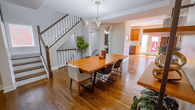 163 E 3rd Ave, Columbus, OH 43201 - dining space with wood finished floors, stairway, and baseboards