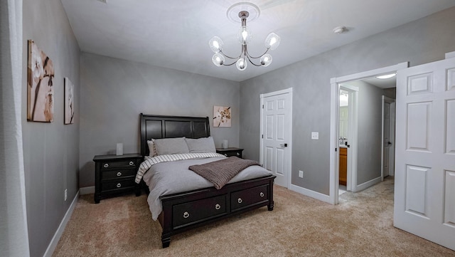 163 E 3rd Ave, Columbus, OH 43201 - bedroom featuring light colored carpet, a chandelier, and baseboards