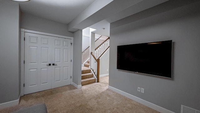 163 E 3rd Ave, Columbus, OH 43201 - entryway with carpet floors, stairway, and baseboards