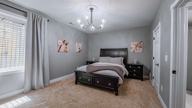 163 E 3rd Ave, Columbus, OH 43201 - bedroom with a chandelier, carpet flooring, and baseboards