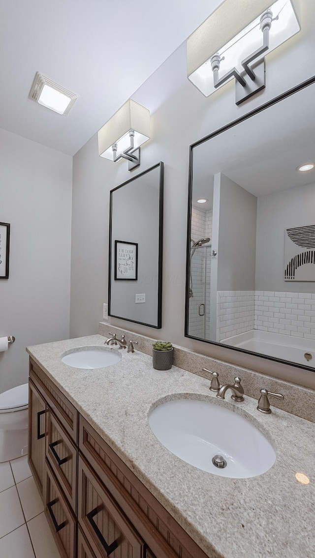 163 E 3rd Ave, Columbus, OH 43201 - bathroom with tile patterned flooring, double vanity, a shower stall, toilet, and a bath