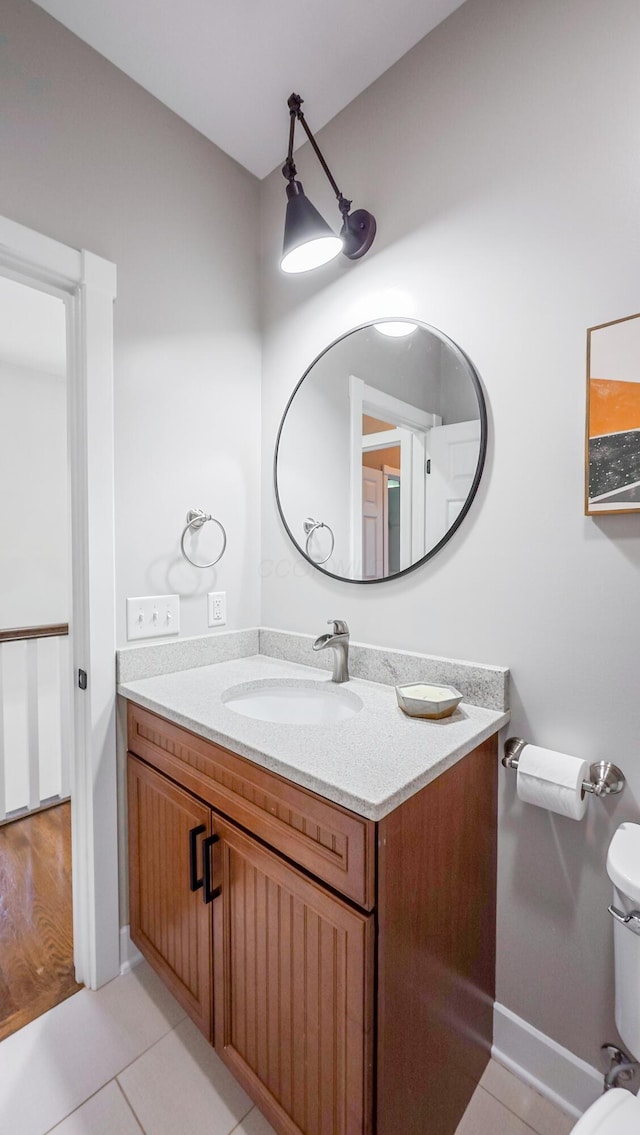 163 E 3rd Ave, Columbus, OH 43201 - bathroom featuring vanity, tile patterned flooring, and toilet