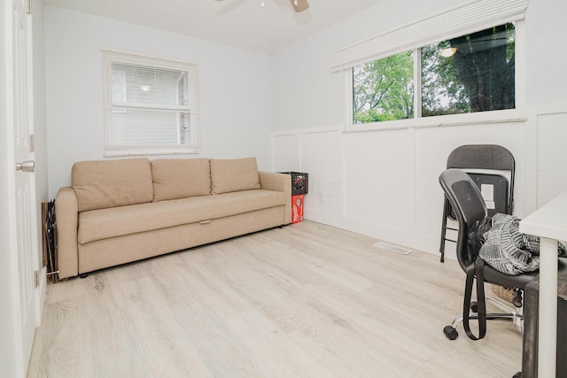 780 Basswood Rd, Columbus, OH 43207 - office area featuring wood finished floors, a ceiling fan, wainscoting, and a decorative wall