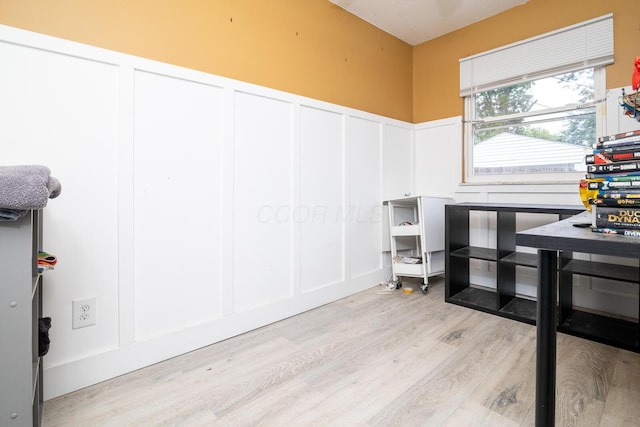 780 Basswood Rd, Columbus, OH 43207 - miscellaneous room featuring a decorative wall, light wood-style floors, and a wainscoted wall