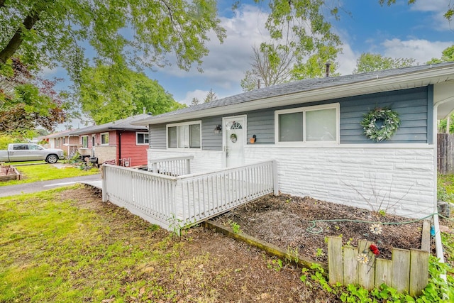 780 Basswood Rd, Columbus, OH 43207 - single story home featuring a deck, stone siding, and roof with shingles
