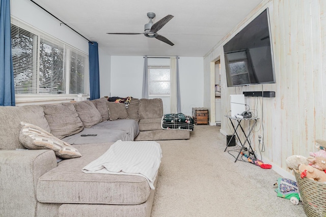780 Basswood Rd, Columbus, OH 43207 - living room featuring carpet floors, ceiling fan, and wood walls