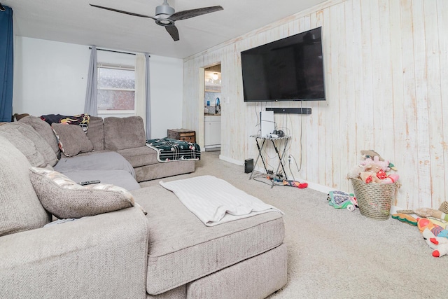 780 Basswood Rd, Columbus, OH 43207 - living room with carpet floors, a ceiling fan, and wooden walls