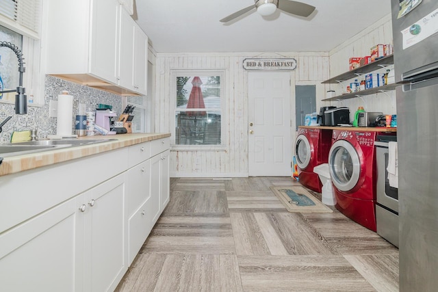 780 Basswood Rd, Columbus, OH 43207 - laundry area featuring washing machine and clothes dryer, a ceiling fan, and electric panel