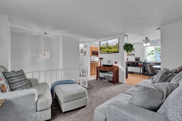 5756 Saffron Ave, Galloway, OH 43119 - living area with ceiling fan, light carpet, and a textured ceiling