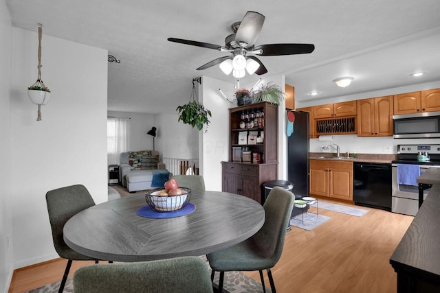 5756 Saffron Ave, Galloway, OH 43119 - dining space with light wood-style floors, ceiling fan, and recessed lighting