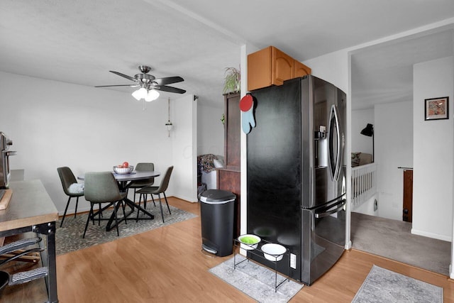 5756 Saffron Ave, Galloway, OH 43119 - kitchen with stainless steel refrigerator with ice dispenser, ceiling fan, and light wood finished floors