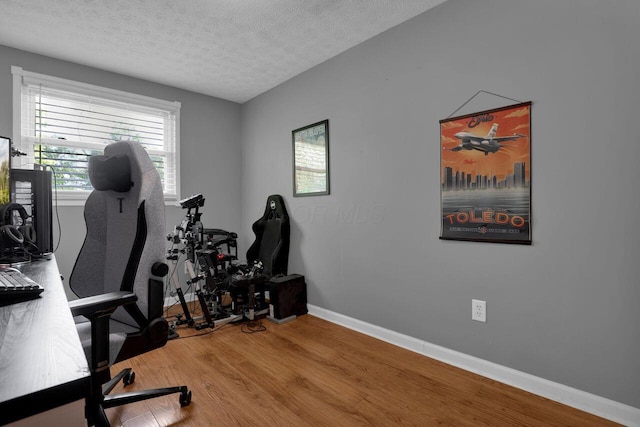 5756 Saffron Ave, Galloway, OH 43119 - home office featuring wood finished floors, a textured ceiling, and baseboards