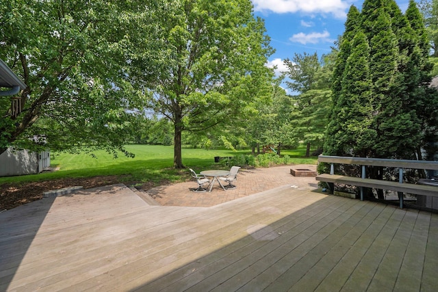 5657 Freeman Rd, Westerville, OH 43082 - wooden terrace with a fire pit, a lawn, and view of scattered trees