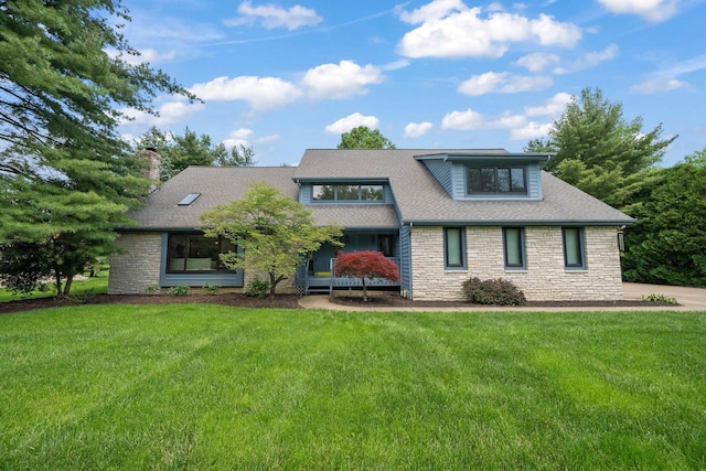 5657 Freeman Rd, Westerville, OH 43082 - view of front of house with stone siding, a chimney, a front yard, and roof with shingles