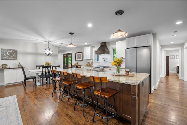 429 N Old State Rd, Delaware, OH 43015 - kitchen featuring custom exhaust hood, recessed lighting, dark wood-style floors, white cabinets, and baseboards