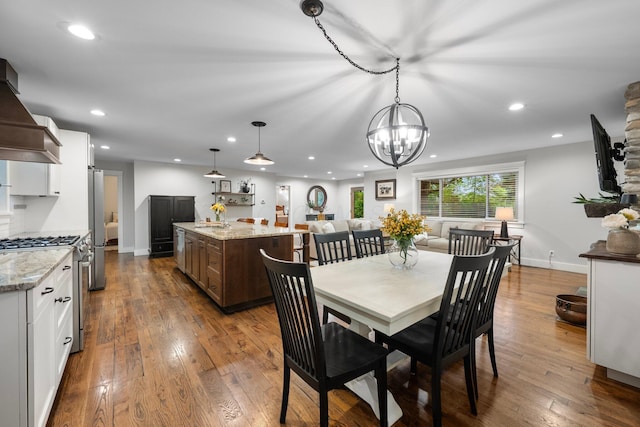 429 N Old State Rd, Delaware, OH 43015 - dining area featuring dark wood-type flooring, a chandelier, recessed lighting, and baseboards