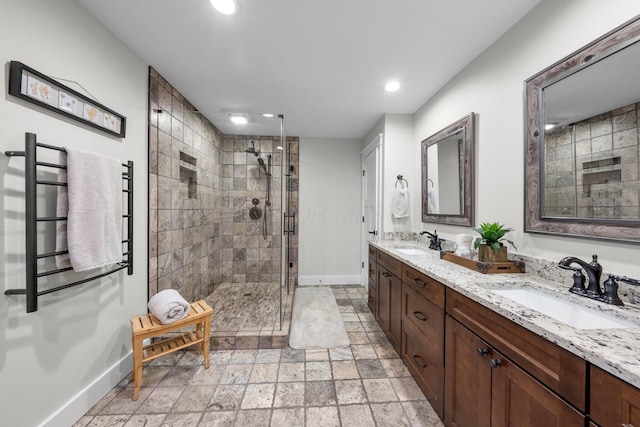 429 N Old State Rd, Delaware, OH 43015 - bathroom with baseboards, recessed lighting, a stall shower, double vanity, and a towel warmer