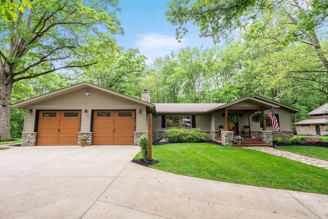 429 N Old State Rd, Delaware, OH 43015 - view of front of home featuring stone siding, a front yard, a chimney, and driveway