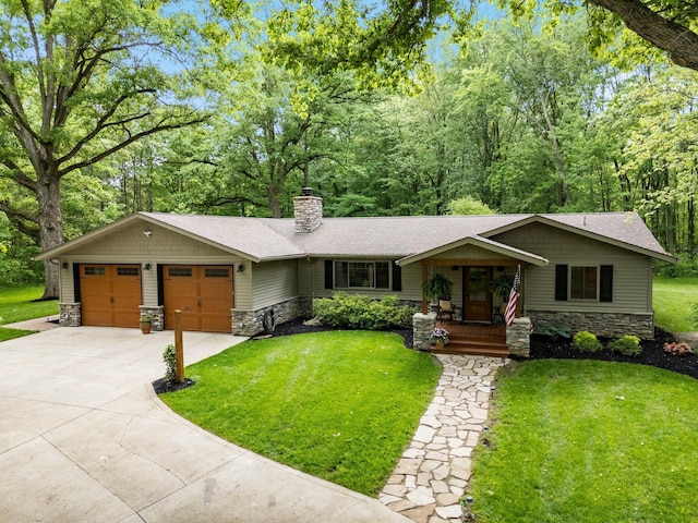 429 N Old State Rd, Delaware, OH 43015 - view of front of house featuring stone siding, a chimney, an attached garage, and a front lawn