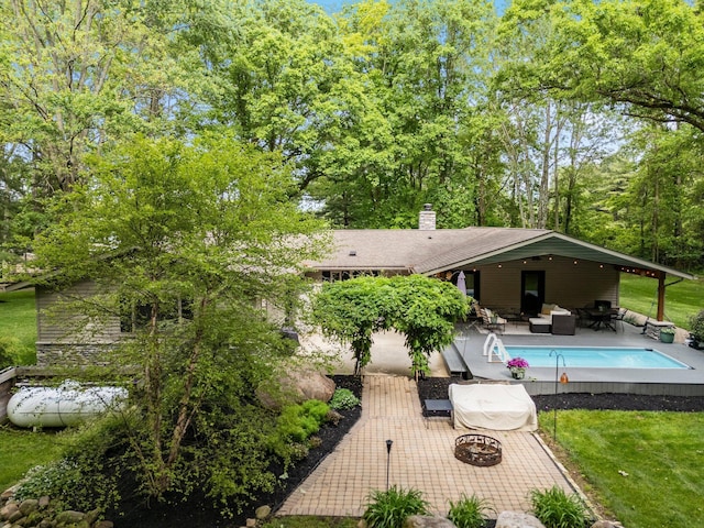 429 N Old State Rd, Delaware, OH 43015 - back of property with an outdoor living space and a chimney