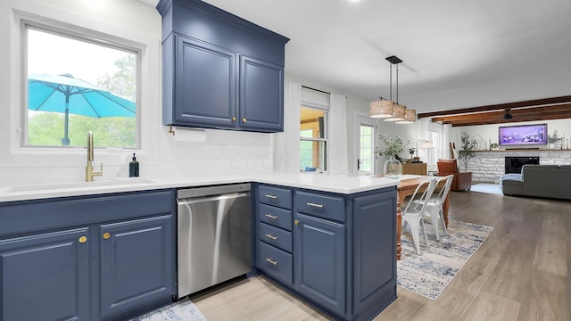 11600 Windridge Dr NW, Pickerington, OH 43147 - kitchen with dishwasher, blue cabinets, a sink, a peninsula, and open floor plan