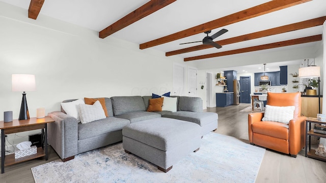 11600 Windridge Dr NW, Pickerington, OH 43147 - living room with light wood-style flooring, a ceiling fan, and beam ceiling