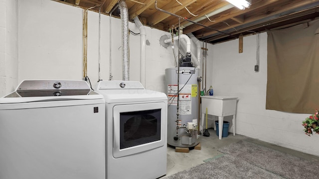 11600 Windridge Dr NW, Pickerington, OH 43147 - clothes washing area with water heater, separate washer and dryer, and concrete block wall