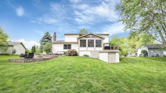 11600 Windridge Dr NW, Pickerington, OH 43147 - back of property featuring stucco siding, a yard, a chimney, a sunroom, and a wooden deck