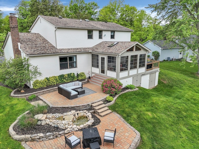 11600 Windridge Dr NW, Pickerington, OH 43147 - rear view of property featuring stucco siding, a patio, a lawn, an outdoor living space, and a shingled roof