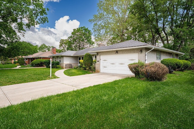 2747 Castlewood Rd, Columbus, OH 43209 - single story home featuring an attached garage, concrete driveway, a front yard, and stucco siding