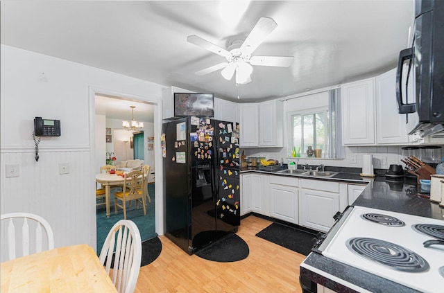 2747 Castlewood Rd, Columbus, OH 43209 - kitchen featuring black appliances, a sink, dark countertops, light wood finished floors, and ceiling fan