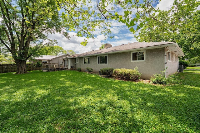2747 Castlewood Rd, Columbus, OH 43209 - back of house with a deck, stucco siding, and a chimney