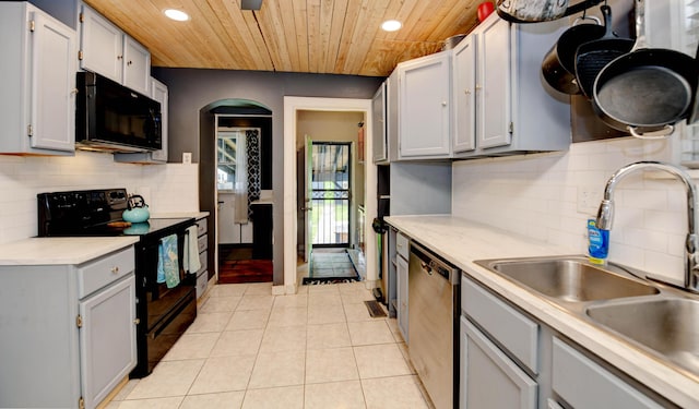 kitchen with black appliances, recessed lighting, a sink, wooden ceiling, and light tile patterned flooring