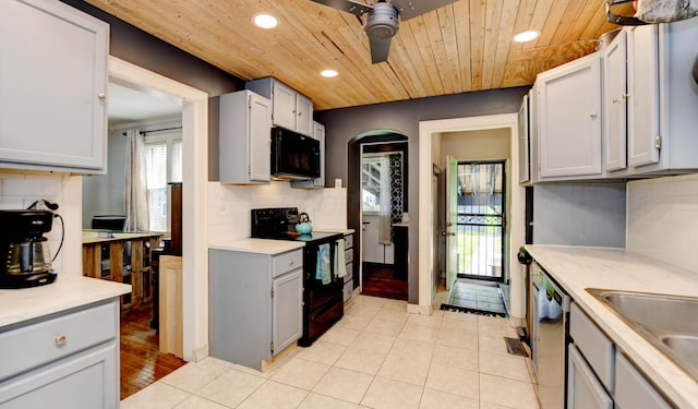 kitchen featuring black appliances, light countertops, recessed lighting, decorative backsplash, and gray cabinets
